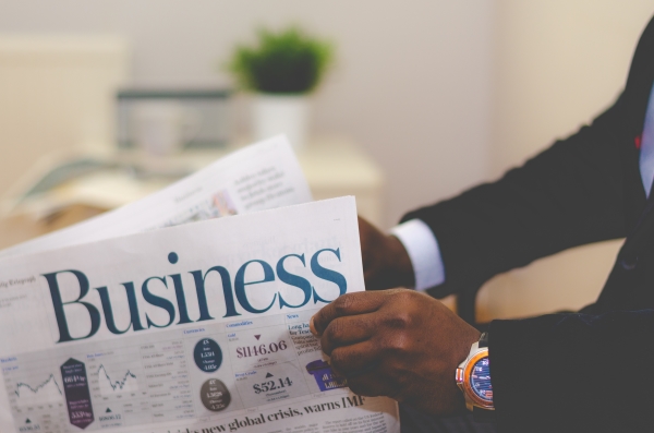 business man reading newspaper